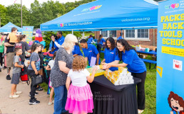 Donation of backpacks and school supplies to 12 schools across the United States