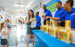 Donation of backpacks and school supplies to 12 schools across the United States